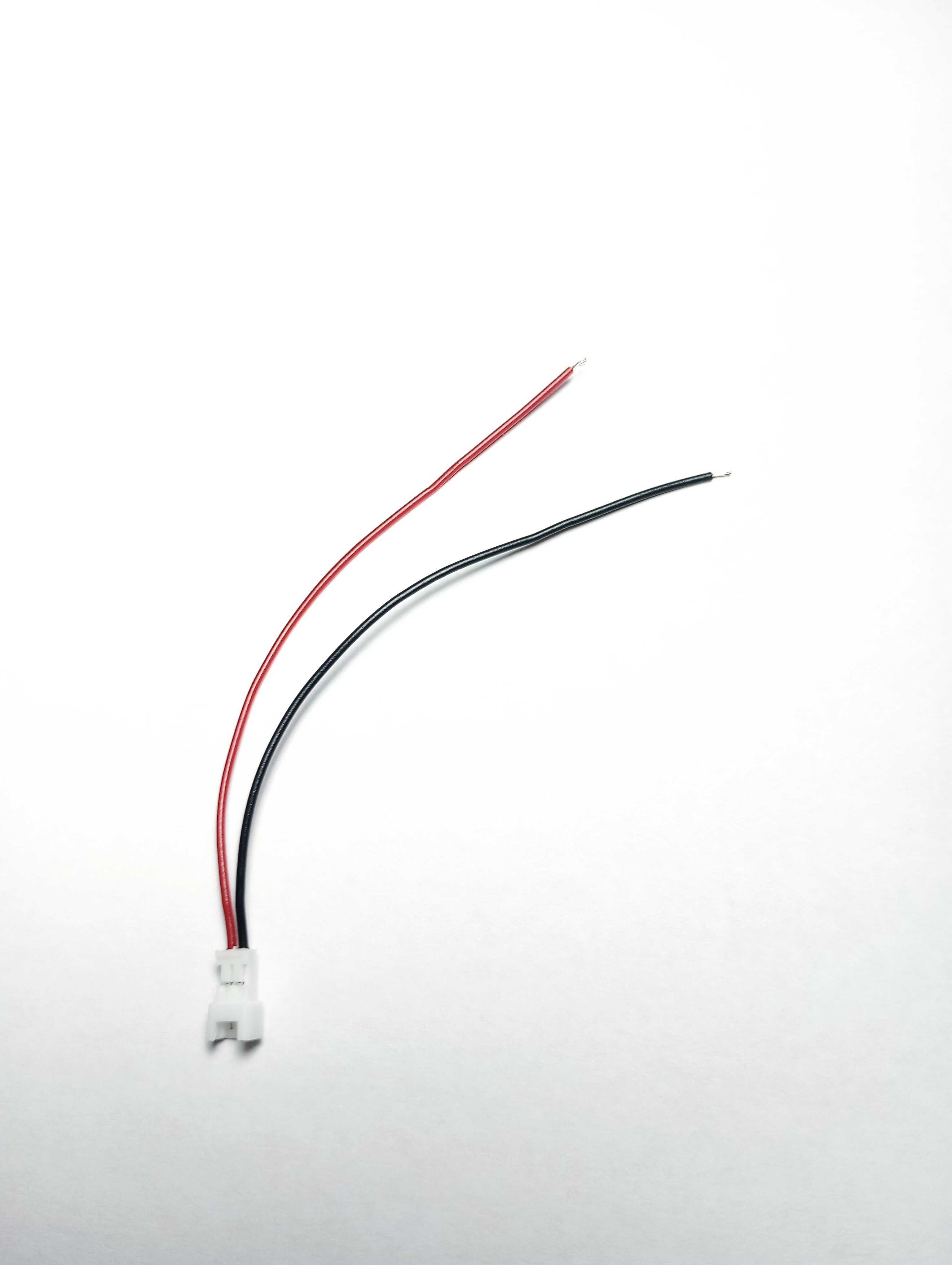 Red and black wires extending from a sensor connector